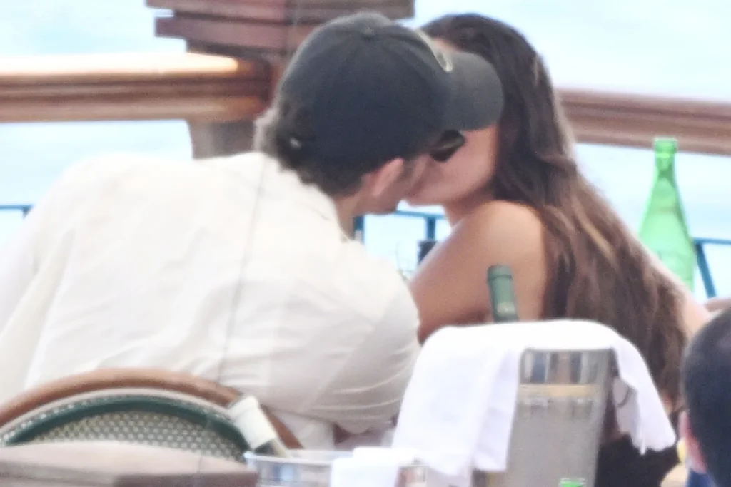 Paul Wesley and Natalie Kuckenburg share a kiss at Lo Scoglio restaurant along the Amalfi Coast on July 17.